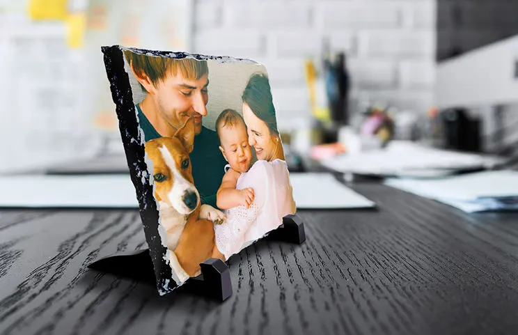 side view of stone slate with baby and mum and dad