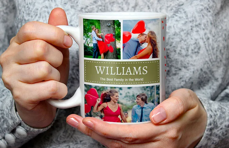 Close up of custom photo mug with a photo collage of family photos and text