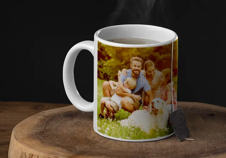 Mum and daughter holding custom designed photo mugs with family photos