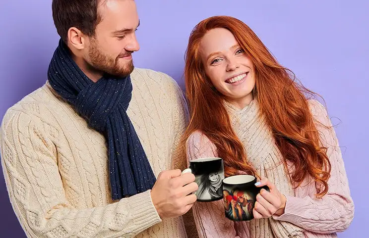 Magic mug with picture of cat on having tea poured into it on desk