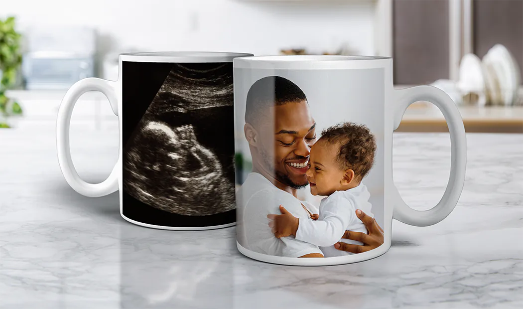 Personalised Photo Mugs by Printerpix|Mum and baby holding Printerpix cartoon design custom mug with dad text|Personalised photo mug with picture of baby crawling wearing animal overall|Mum and daughter holding custom designed photo mugs with family photos|Kissing couple with personalised mugs with text on|Personalised photo mug with your own photo of a dog on|||||