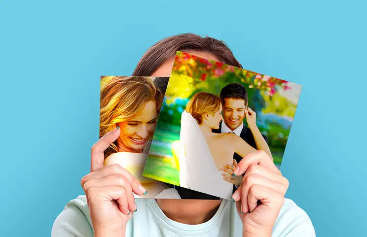 Woman holding two wedding metal photo prints